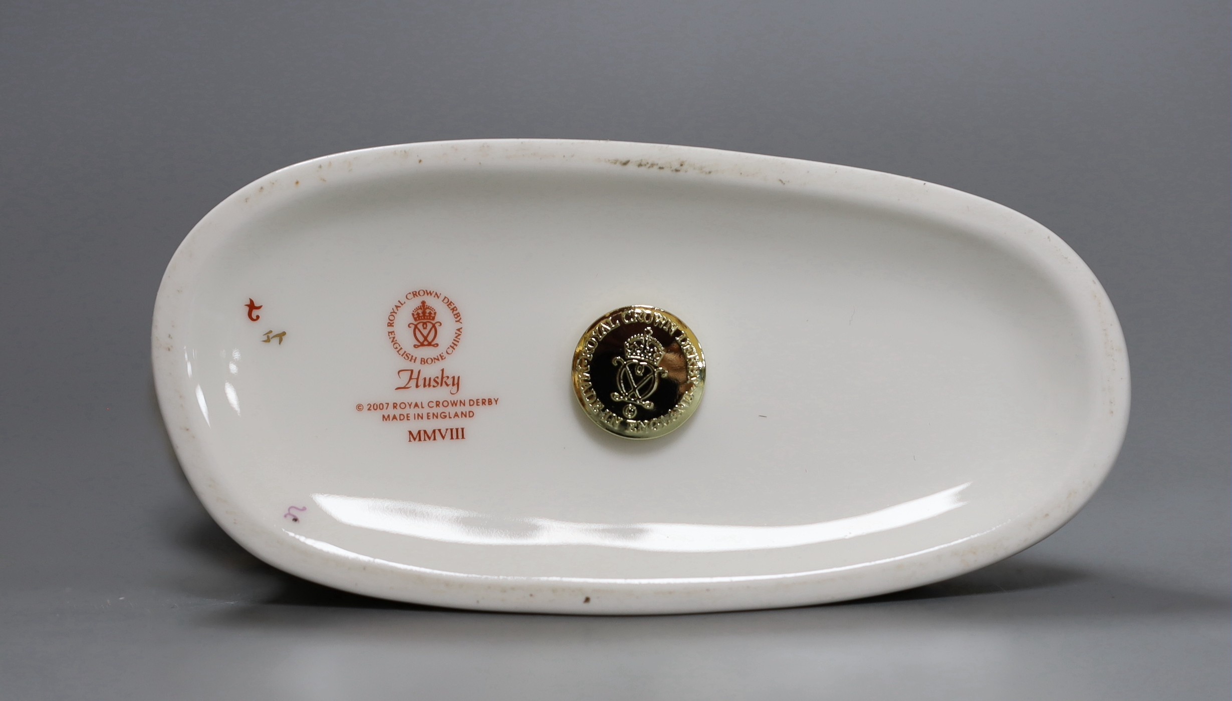 A Royal Crown Derby paperweight - Husky, gold stopper, boxed, no certificate